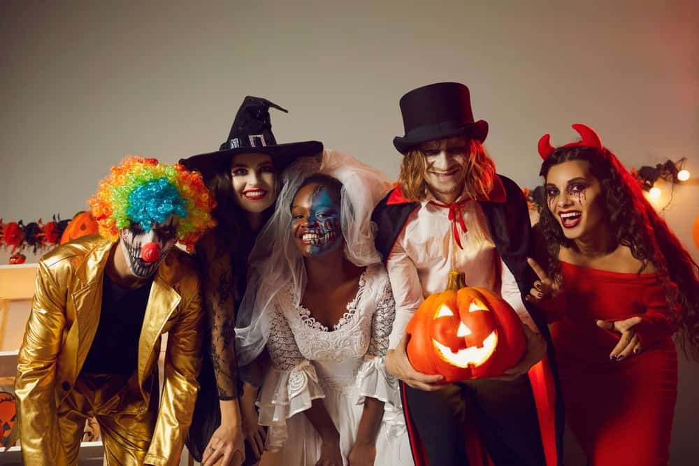 people dressed in costumes for Halloween costume party